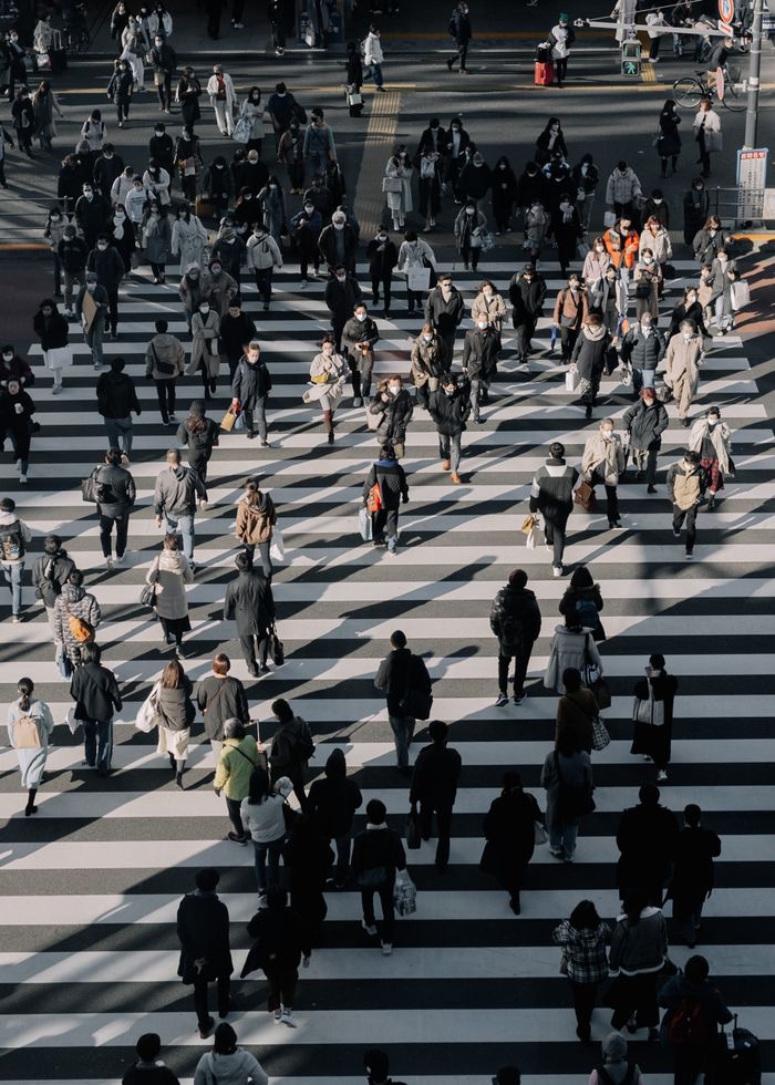 Crowd crossing the street in Shinjuku City, Tokyo, Japan.
